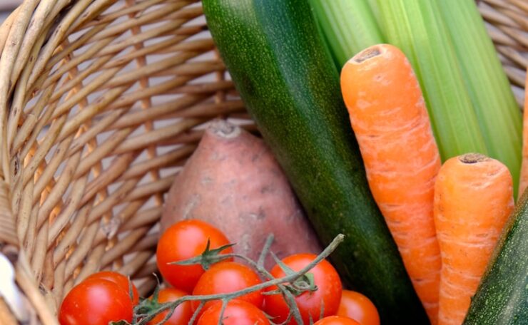 carrots and cucumber on brown woven basket